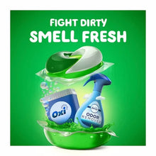 Gain Flings laundry detergent pacs with Oxi booster and odor remover spray on green background
