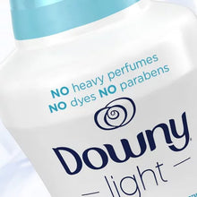 Downy Light liquid fabric softener bottle with no heavy perfumes dyes or parabens highlighting Downy Ocean Mist scent booster beads