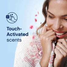 Woman enjoying soft fabric with touch-activated scents promotion for Downy Ultra Infusions fabric conditioner
