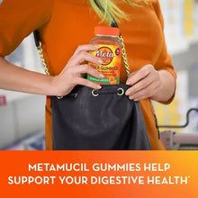 metamucil-fiber-gummies-no-sugar-added-hand-putting-bottle-in-bag - USA Mega Market